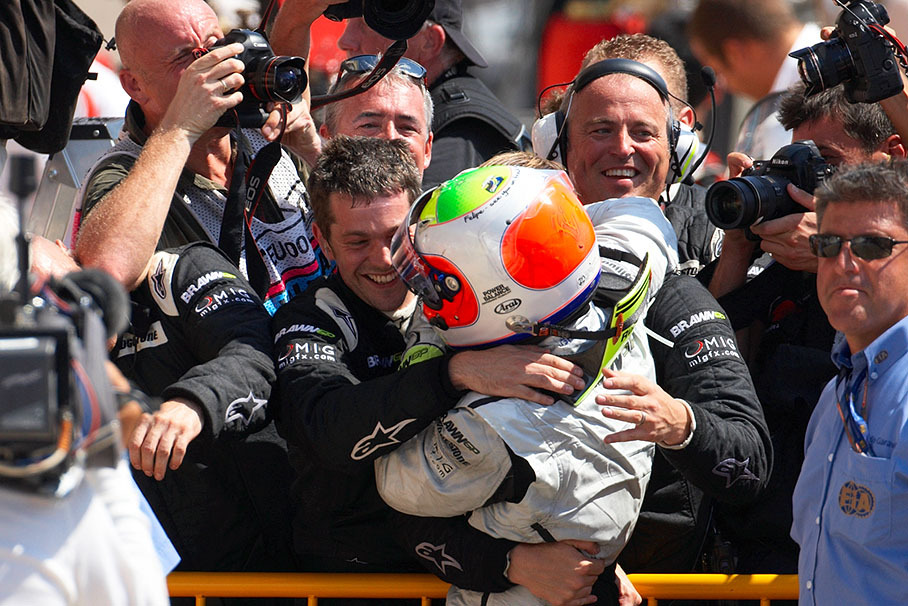 Winner Rubens Barrichello celebrates with the mechanics in parc ferme