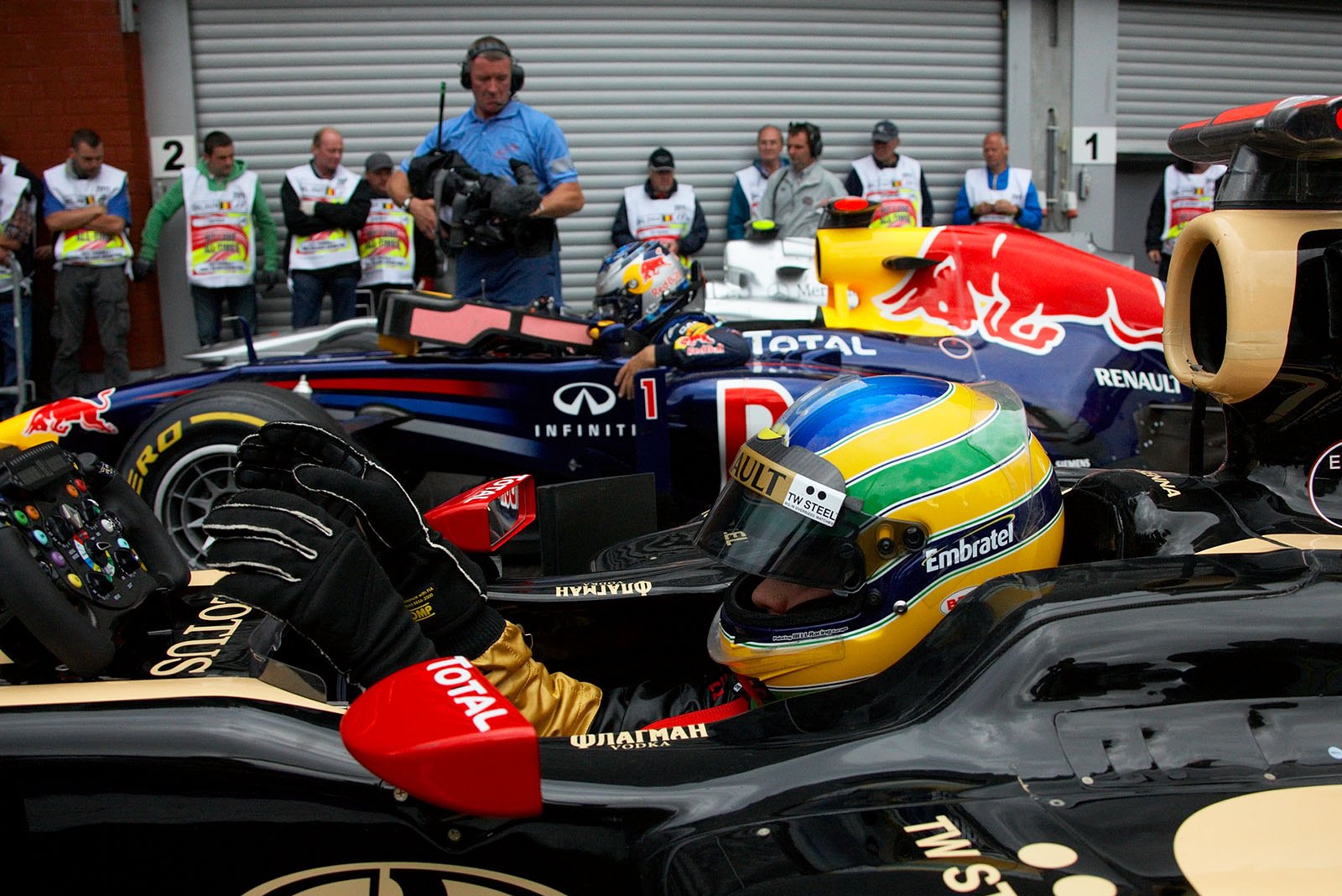 The fabulous seventh grid positioned Bruno Senna on Renault arrives at parc ferme besides polesetter Sebastian Vettel of Red Bull Racing