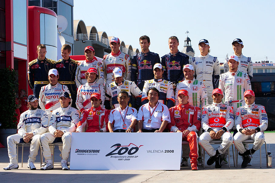 Bridgestone celebrates the company's 200th supplied Grand Prix with a drivers group photo together with motorsport director Hiroshi Yasukawa and Hirohide Hamashida, director of motorsport tyre development