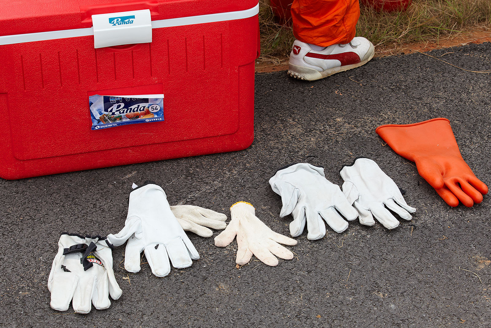 The marshal's damp gloves wait in order to be worn for the practice session