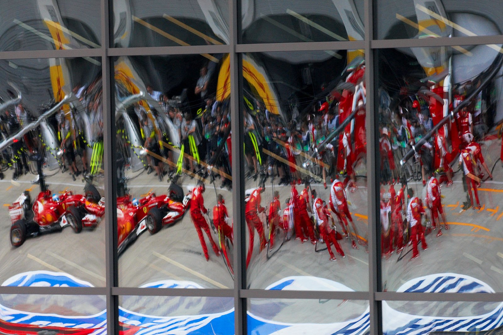 A nice reflection of Alonso's Ferrari, as he drives into the pits