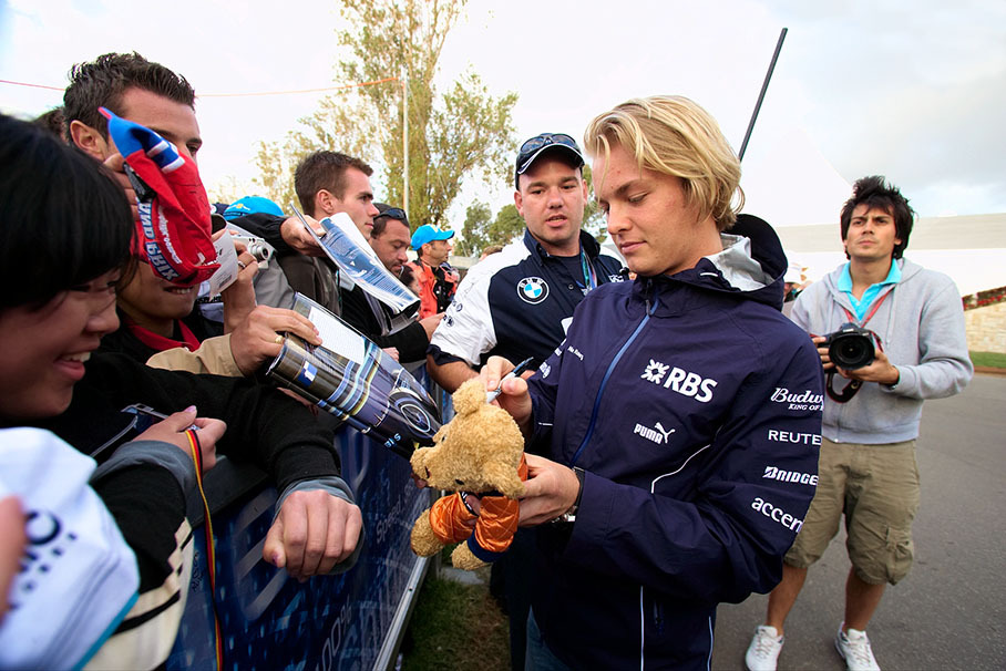 Nico Rosberg playing with a Teddy bear