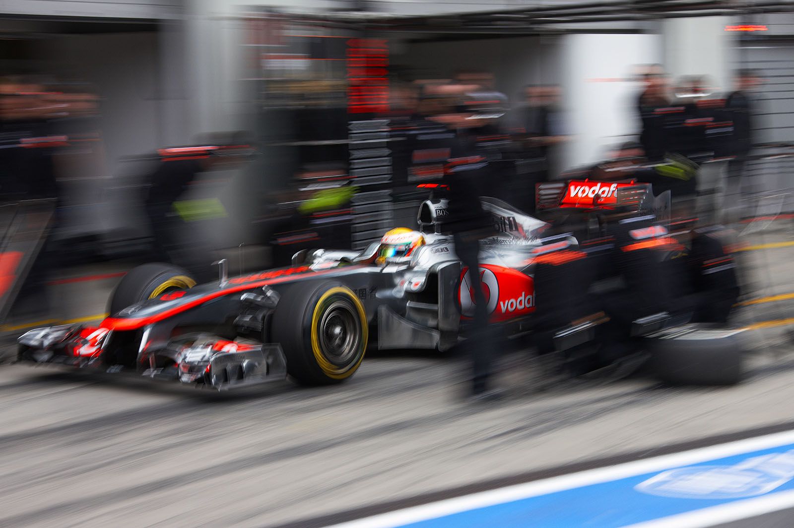Lewis Hamilton ejects from McLaren pits
