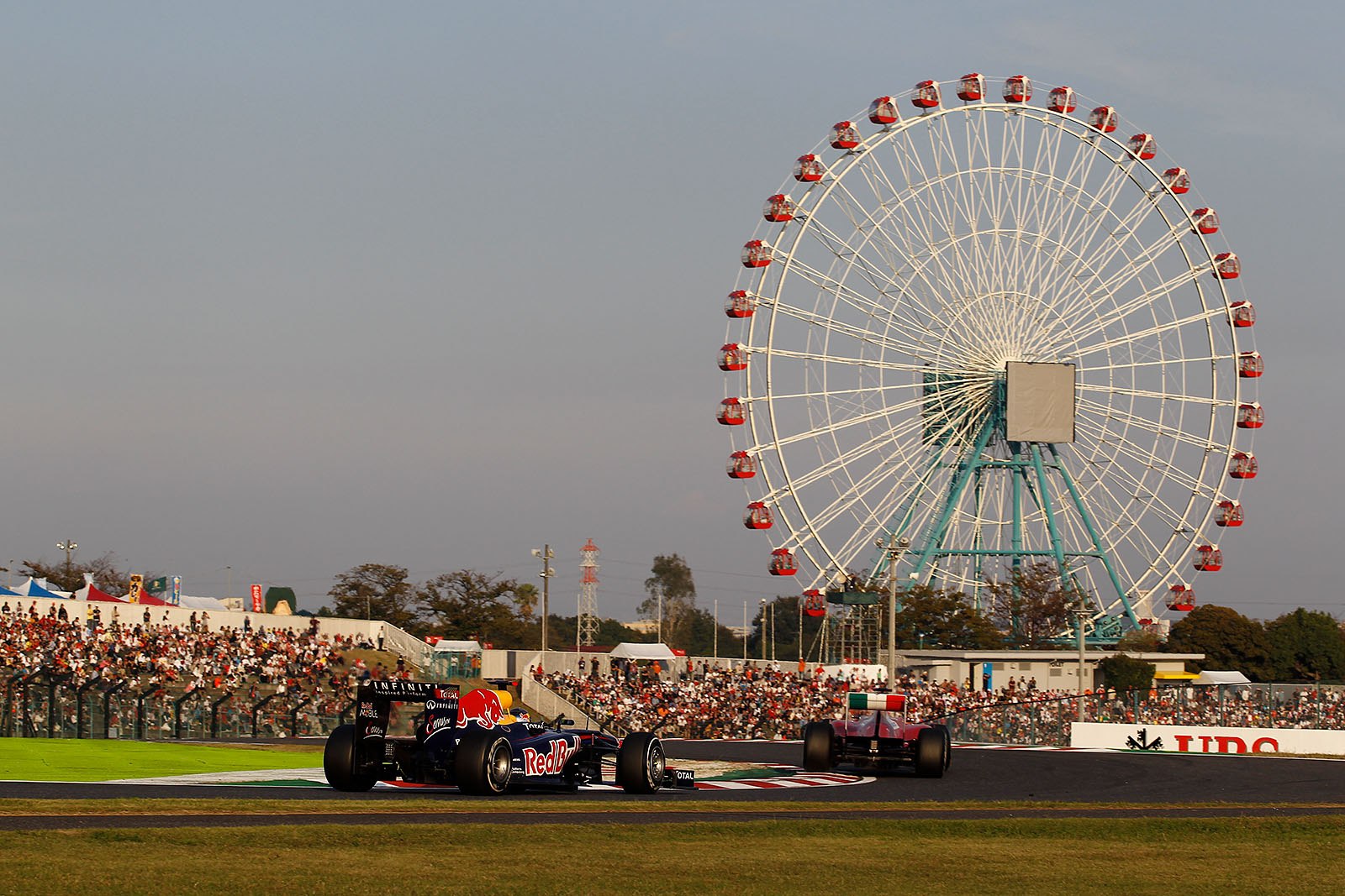 Sebastian Vettel, Red Bull Racing, keeps position three behind Alonso and race leader Button