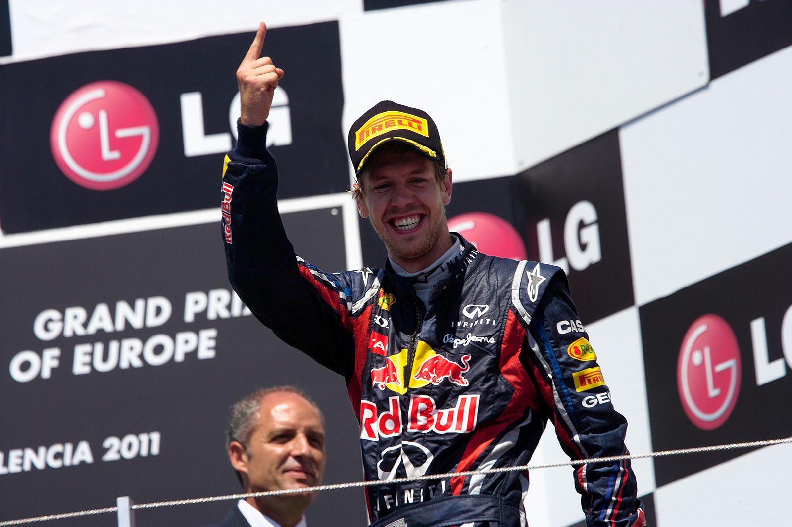 Race winner Sebastian Vettel celebrates on the podium