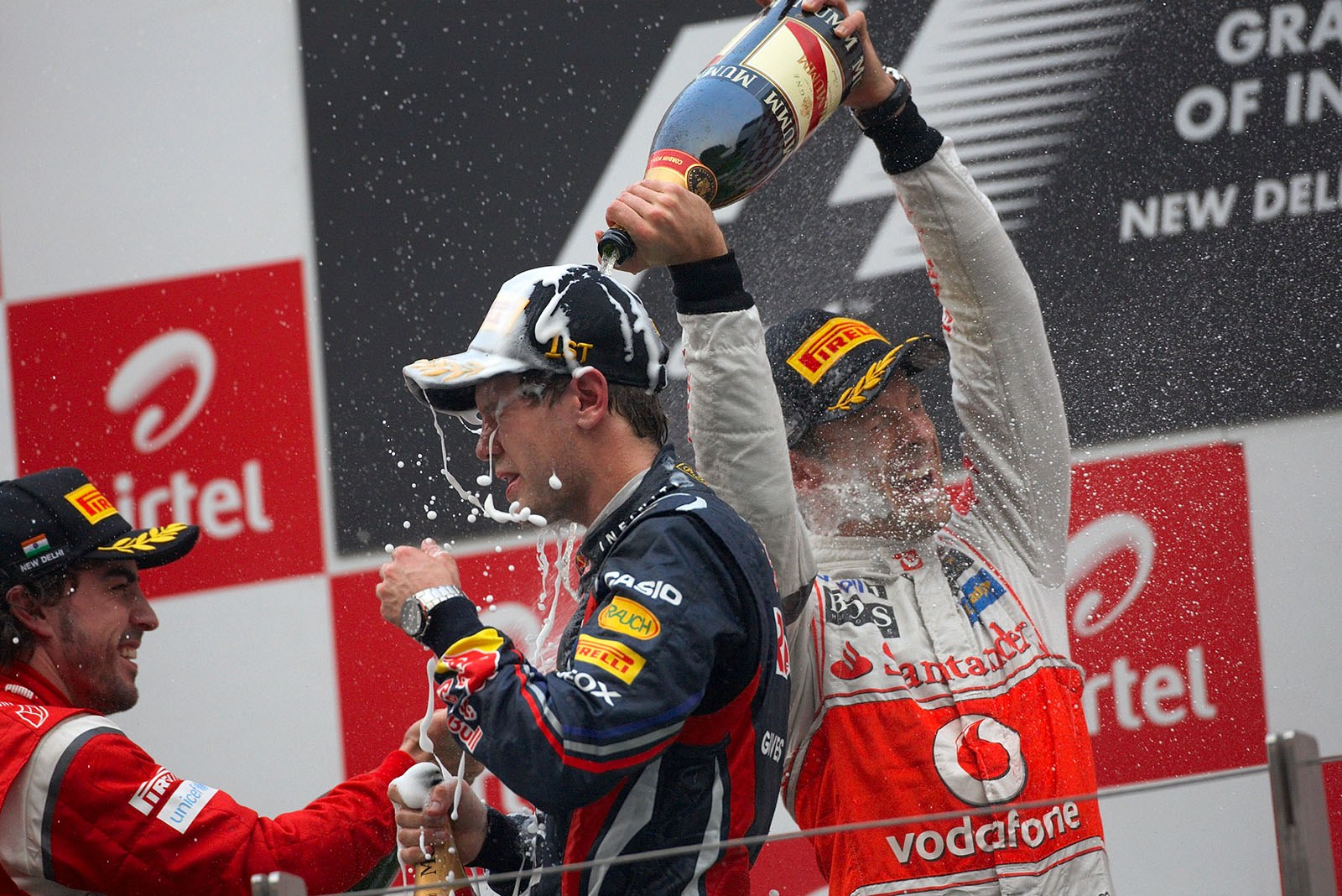 Champagne showers for winner Vettel