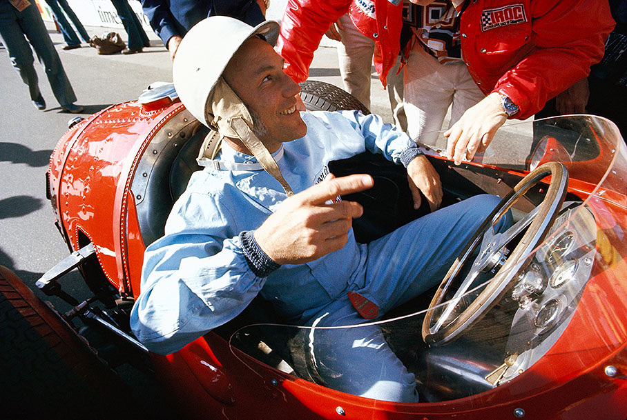 Former F1 driver Stirling Moss in a Maserati 250F
