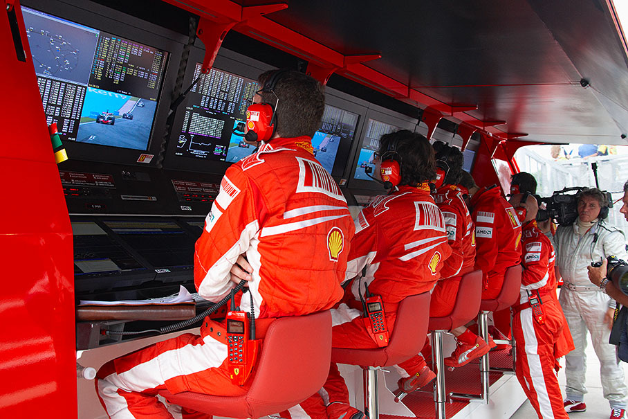 Ferrari race engineer Chris Dyer watches Hamilton on his screen