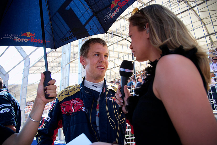 Sebastian Vettel is being interviewed on the grid