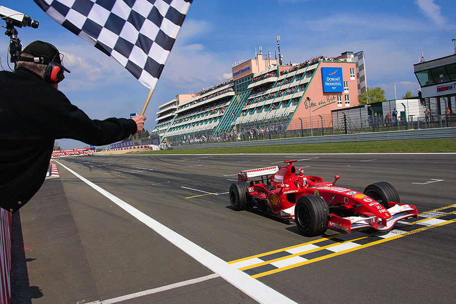 Michael Schumacher crossing the finish line to win the European Grand Prix at Nuerburgring