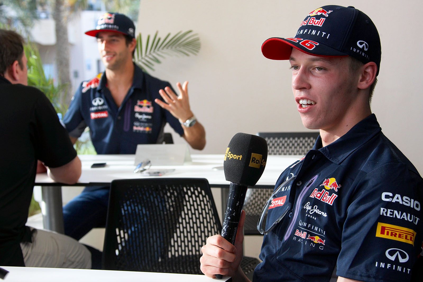 Red Bull drivers Daniil Kvyat and Ricciardo (in the back)