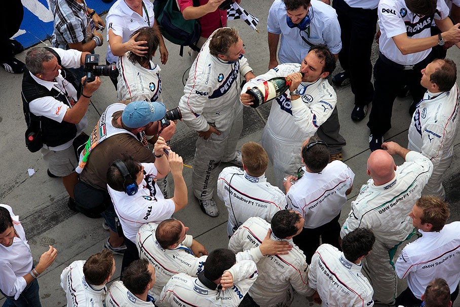 BMW Sauber race engineer Giampaolo Dall'Ara takes a deserved sip of champagne