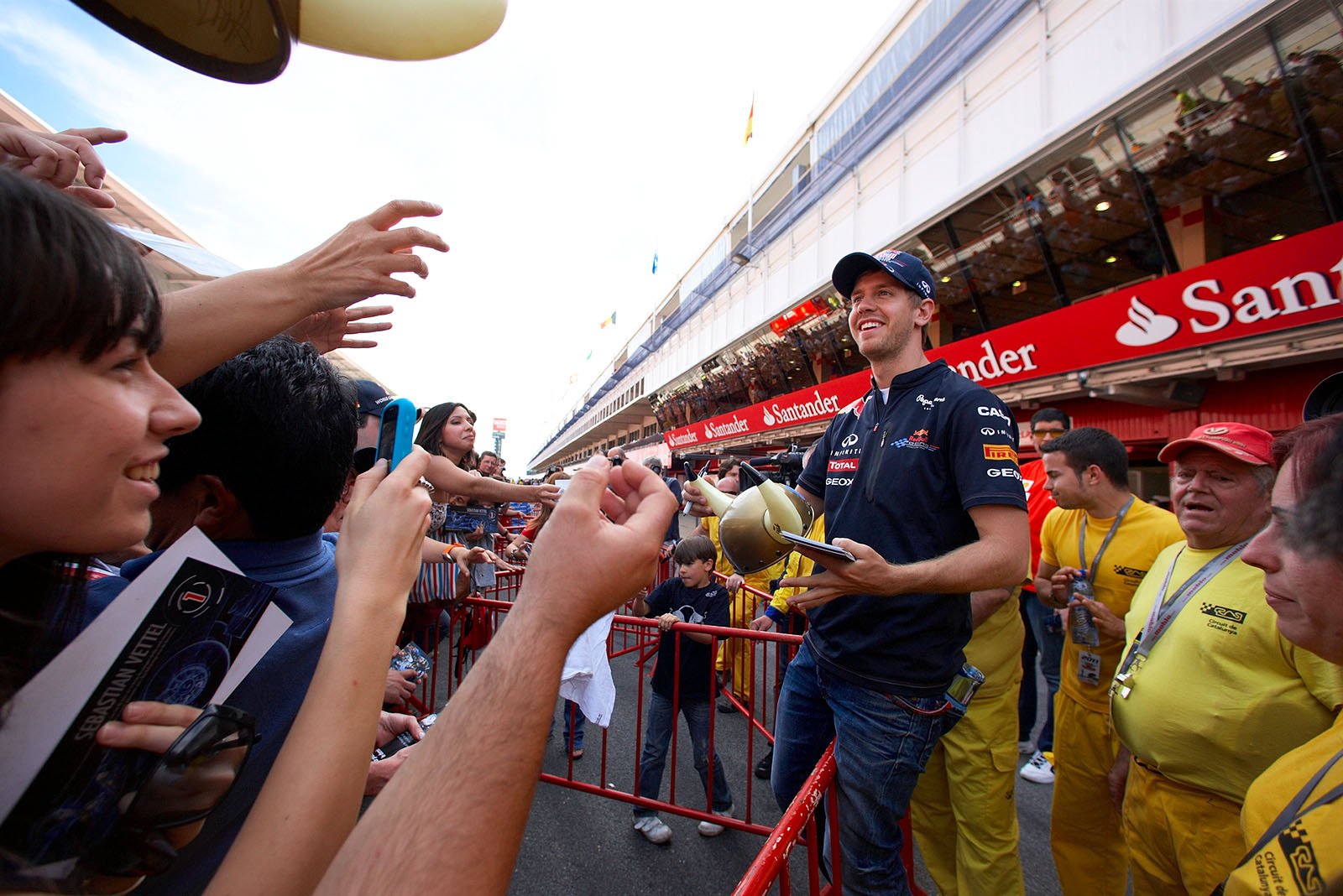 Happy fans and relaxed Sebastian Vettel.