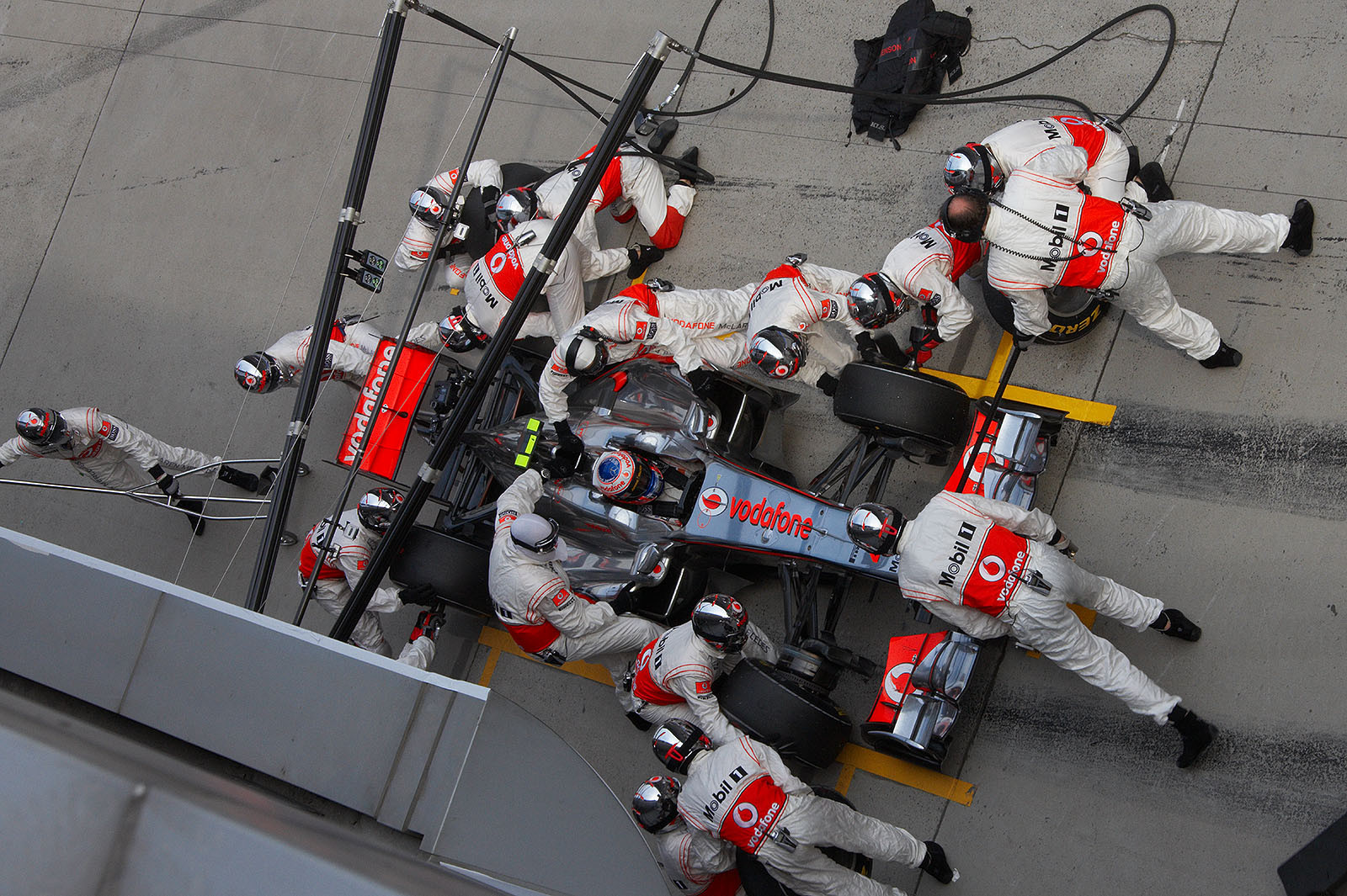 Jenson Button picks new tyres up at McLaren pits