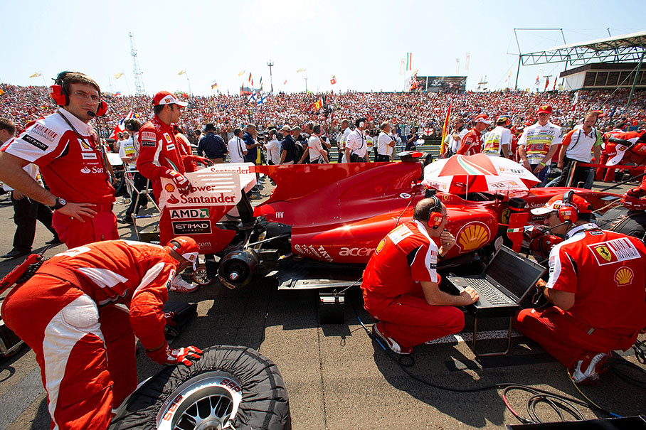 Massa's Ferrari car is prepared on the grid before the race