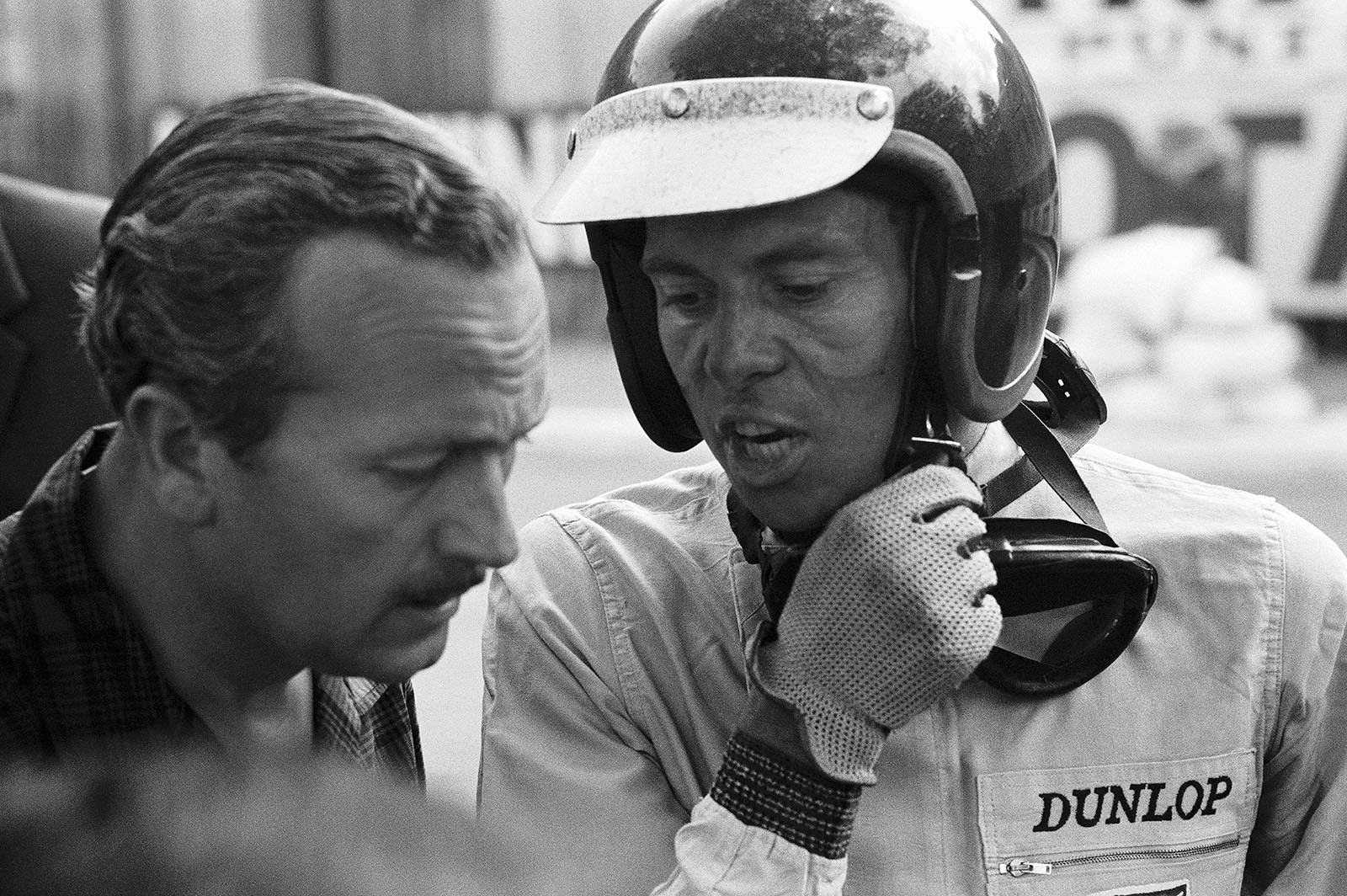 On lap 78 Jim Clark's gearbox locked up. Disappointed he reports to Lotus team boss Colin Chapman, who came running, about the reason for his retirement, Monaco Grand Prix, 1963.