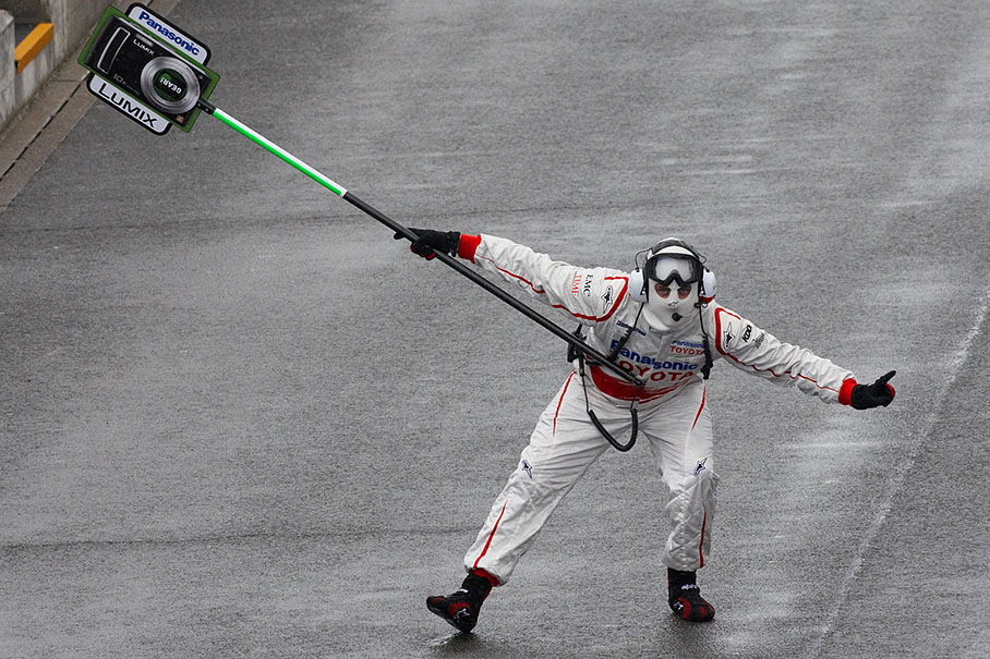 The performance of the Toyota crew's ballet is being started with the 'Lollipop man dance'