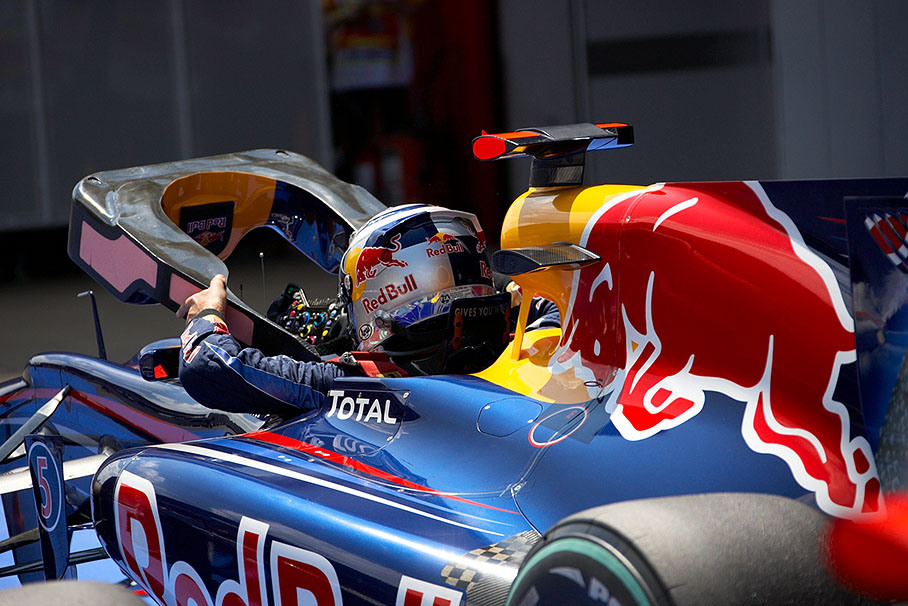After Q3, second qualifier Sebastian Vettel unmounts his cockpit's armouring in parc ferme