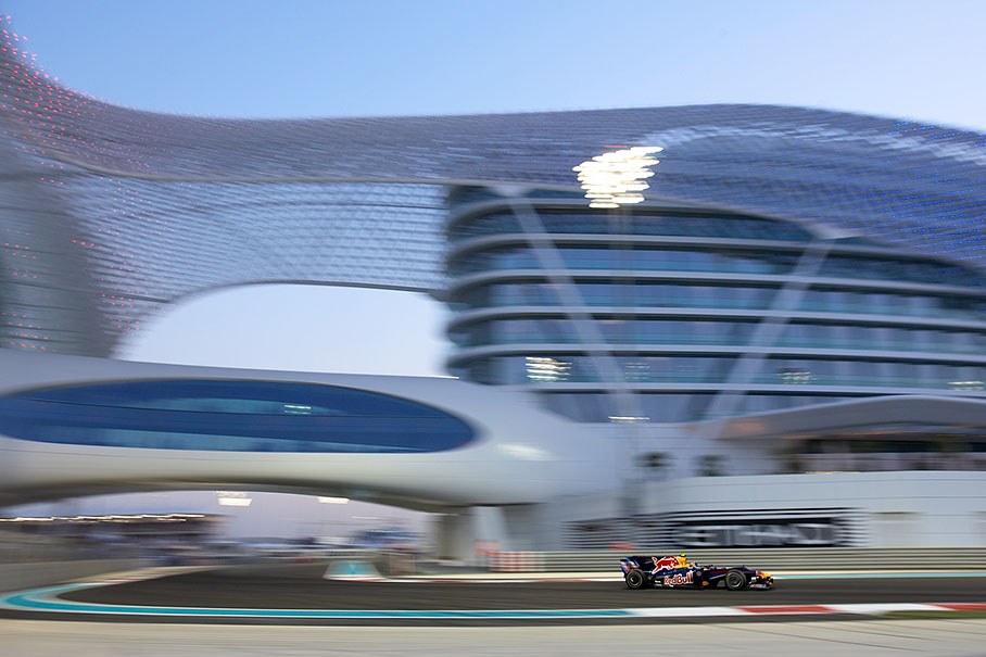 Sebastian Vettel, Red Bull Racing, in front of the Yas Marina Hotel complex
