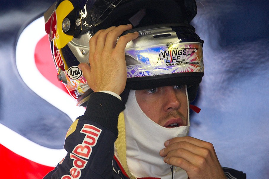 Sebastian Vettel, Red Bull Racing, puts his helmet on before the practice session