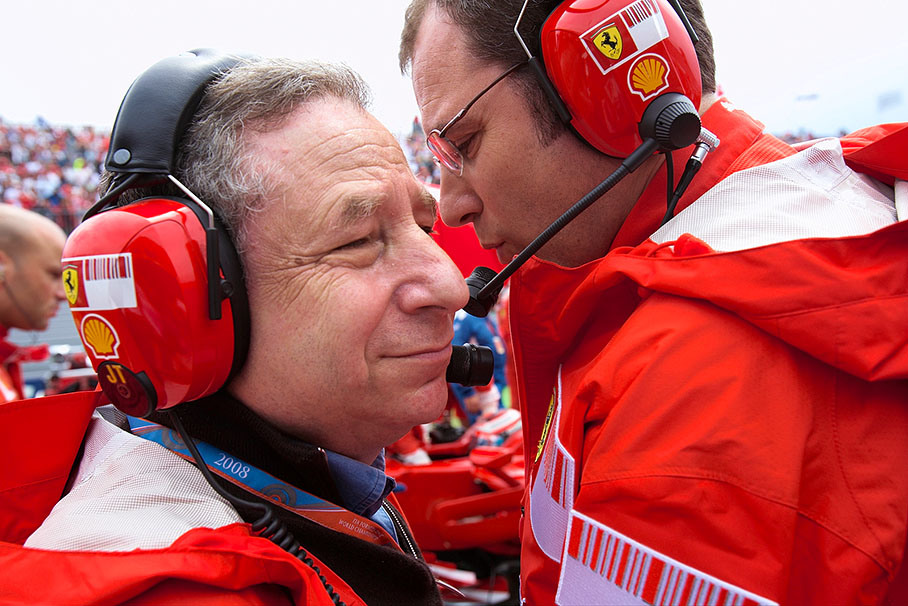 Long-time Ferrari team boss Jean Todt visits his successor Stefano Domenicali on the grid
