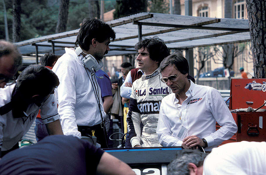 Brabham driver Nelson Piquet talks with car designer Gordon Murray whilst team principal Bernard Ecclestone listens