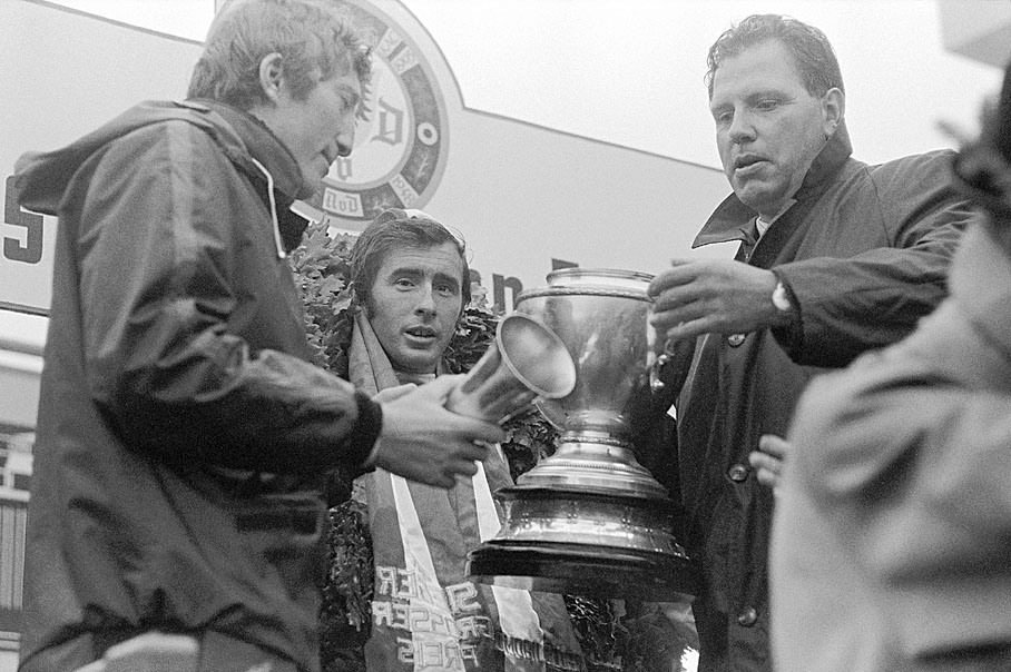 Winner Jackie Stewart on the podium with third placed Jochen Rindt receives the trophy for his greatest Grand Prix victory
