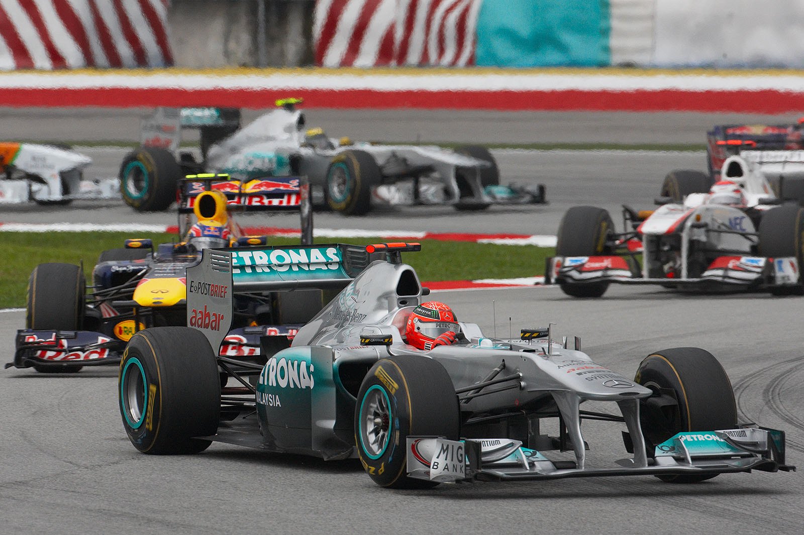Mercedes star Michael Schumacher has a good start and comes out in front of Webber and Kobayashi