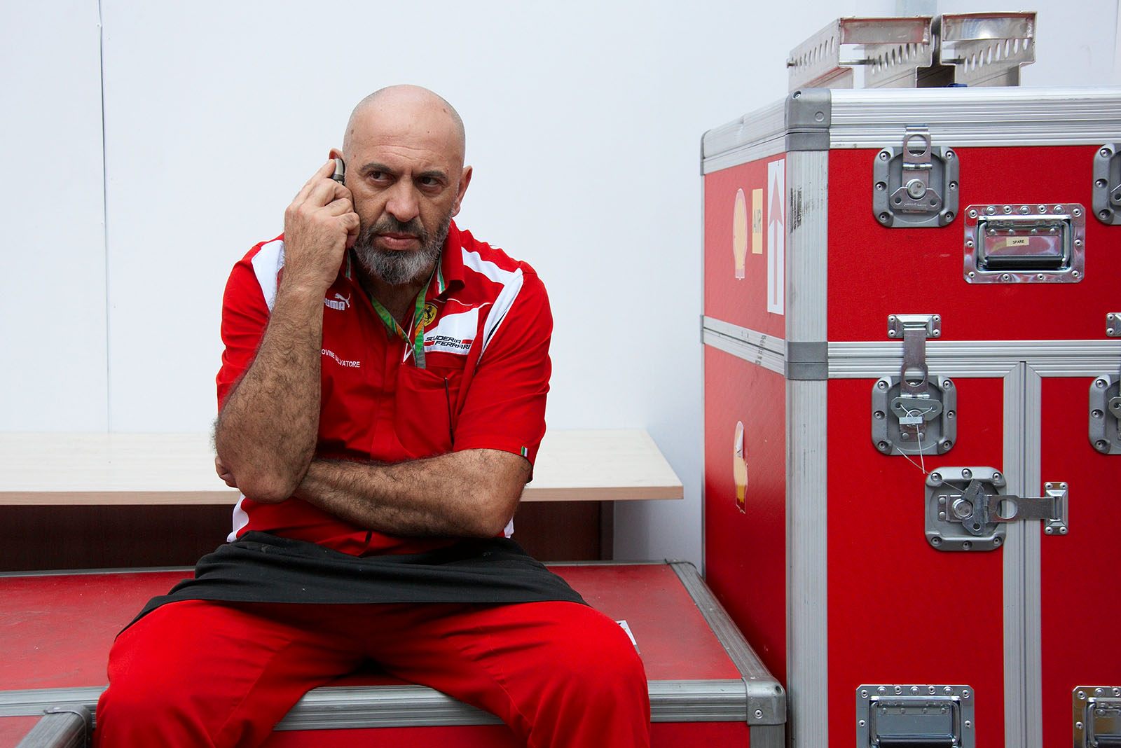 Salvatore organises the office behind the Ferrari Media motorhome