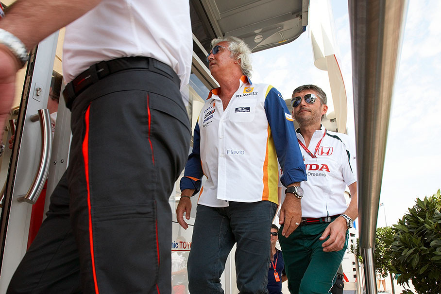 Briatore and Fry enter the Toyota motorhome meeting room