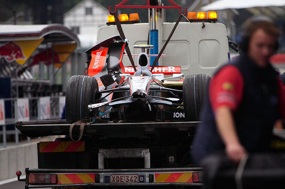 Fisichella's damaged Force India car is being returned to pits after a spin on Friday afternoon