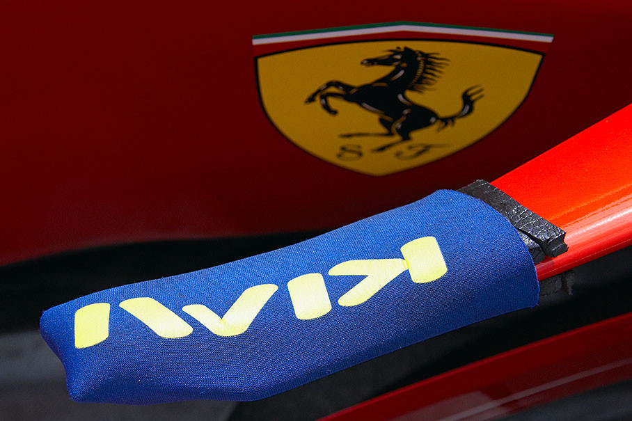 An overcoat protects a sharp aerodynamical edge of Kimi's Ferrari