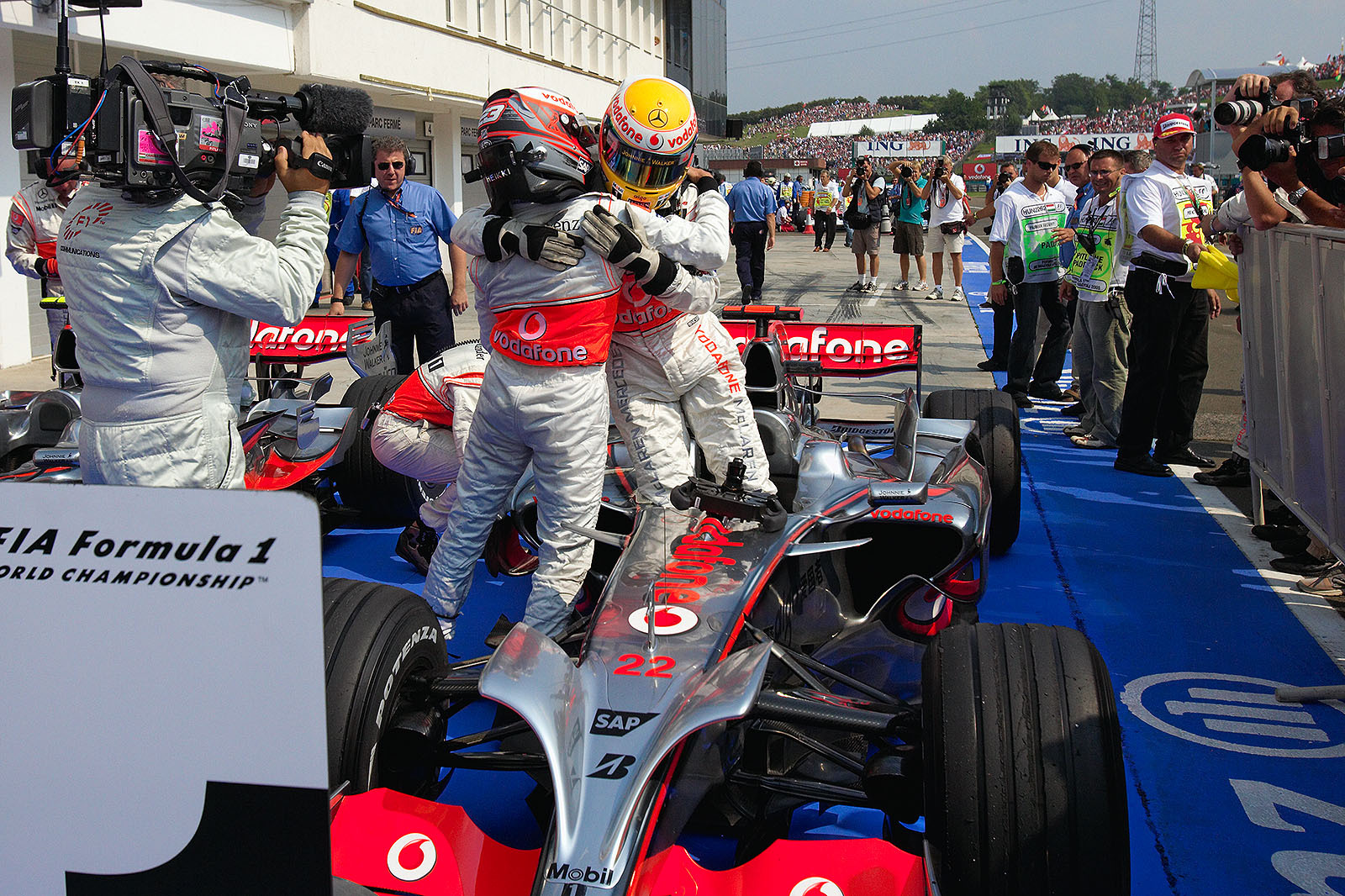 Polesitter Hamilton and McLaren team mate Kovalainen congratulate each other for a silver grid front row