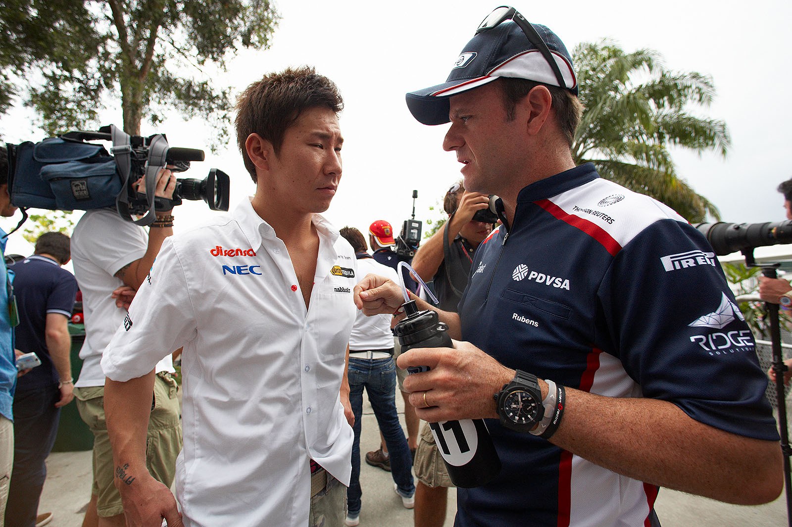 Sauber's Kamui Kabayashi with Rubens Barrichello of Williams