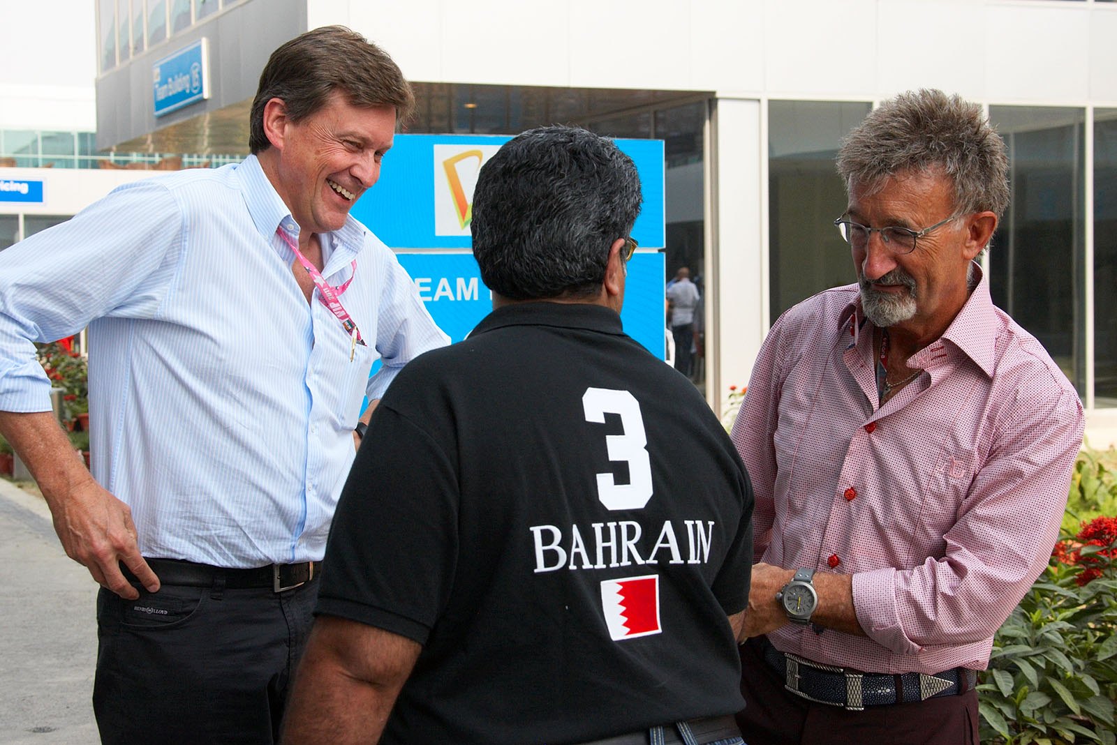 President of the Bahrain Motor Federation and FIA delegate Sheikh Abdulla Bin Isa Al-Khalifa jokes around with BBC TV presenters Eddie Jordan and Martin Whitaker (left hand)
