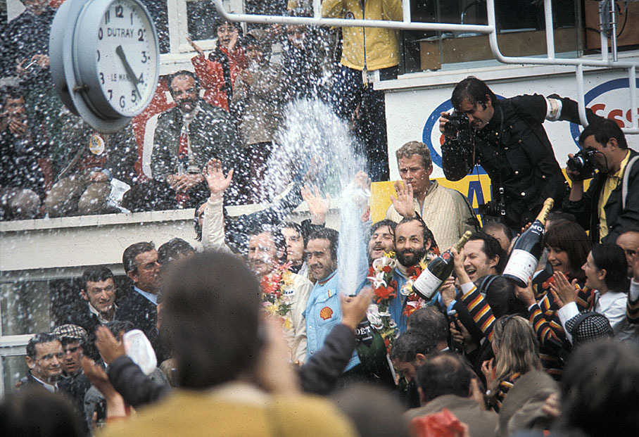 Champagne shower for Henri Pescarolo, Graham Hill and Howden Ganley