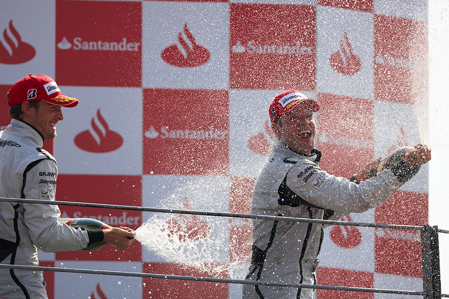 Champagne showers for Rubens Barrichello (right) and Jenson Button