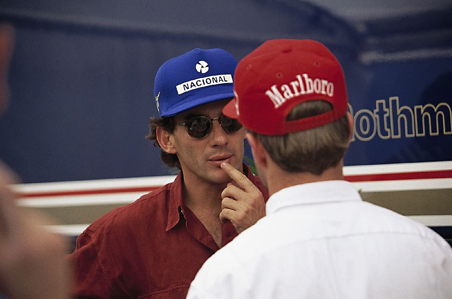 Ayrton Senna chats with Rubens Barrichello who crashed heavily in Friday practice during the tragic weekend in Imola that claimed lifes of Roland Ratzenbeger and Ayrton Senna.