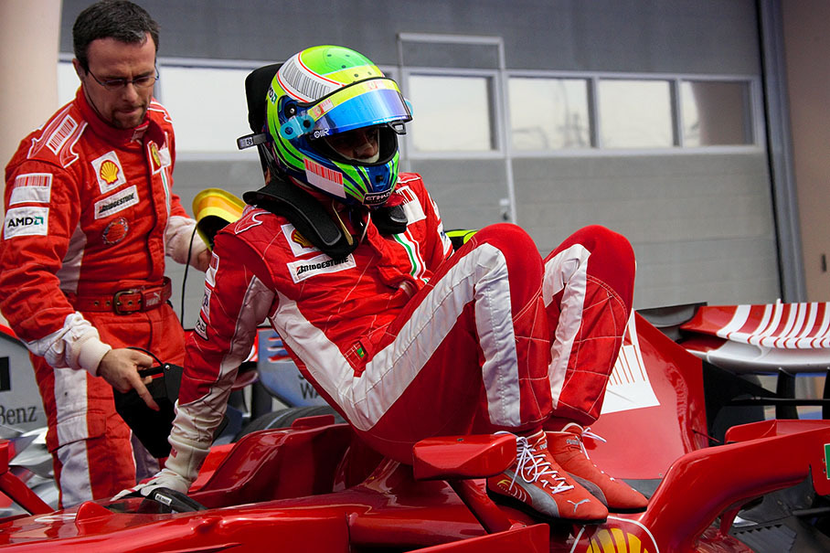 Felipe Massa jumps out of his Ferrari