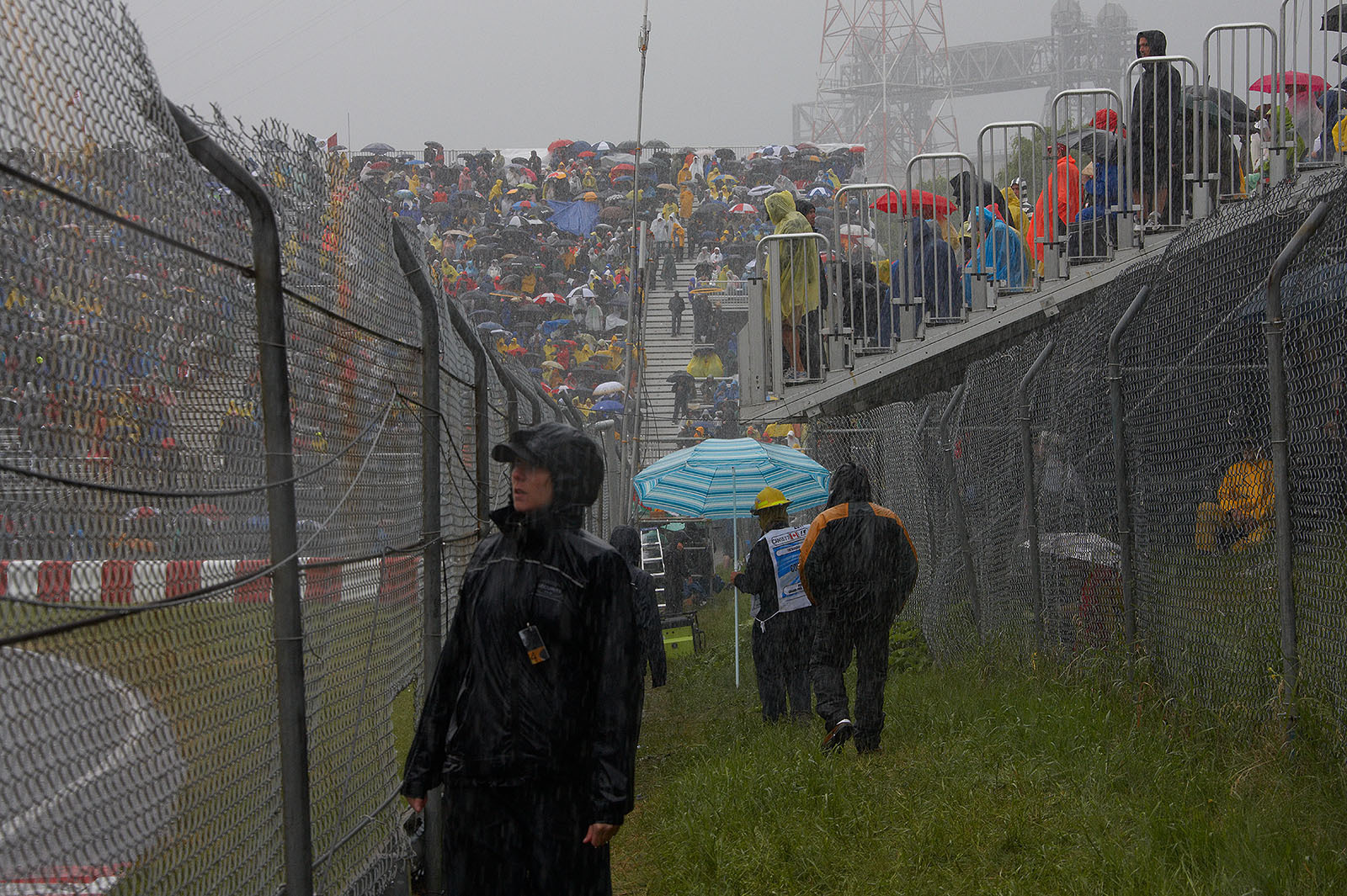The fans endure in heavy rain on the stands