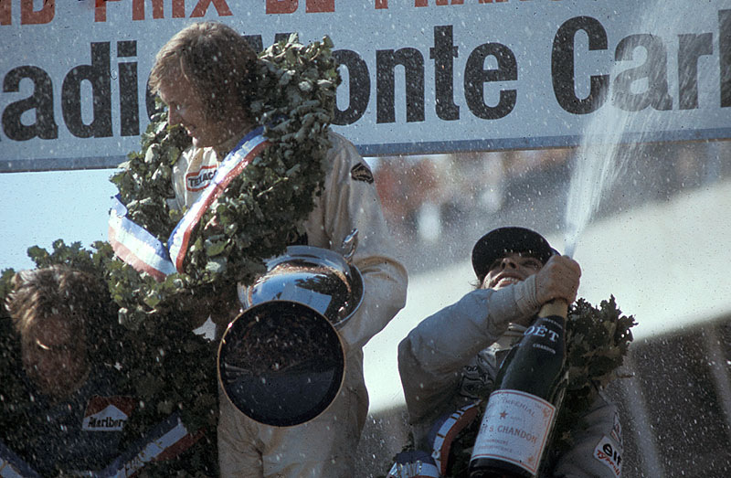 Champagne showers on the podium after the French GP 1973 for winner Peterson and second placed Cevert