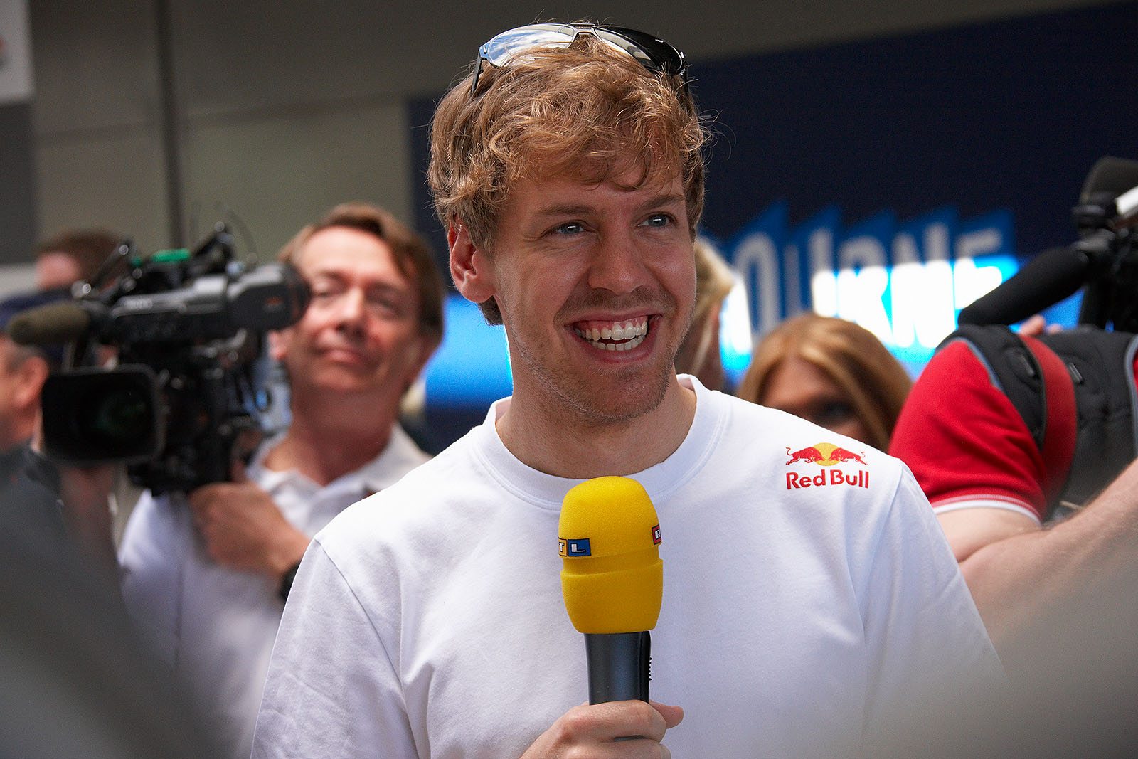 Sebastian Vettel smiles at the TV audience during an interview on Sunday noon