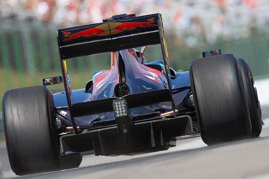 Newcomer Jaime Alguersuari spins the wheels of his Toro Rosso car at pit lane exit