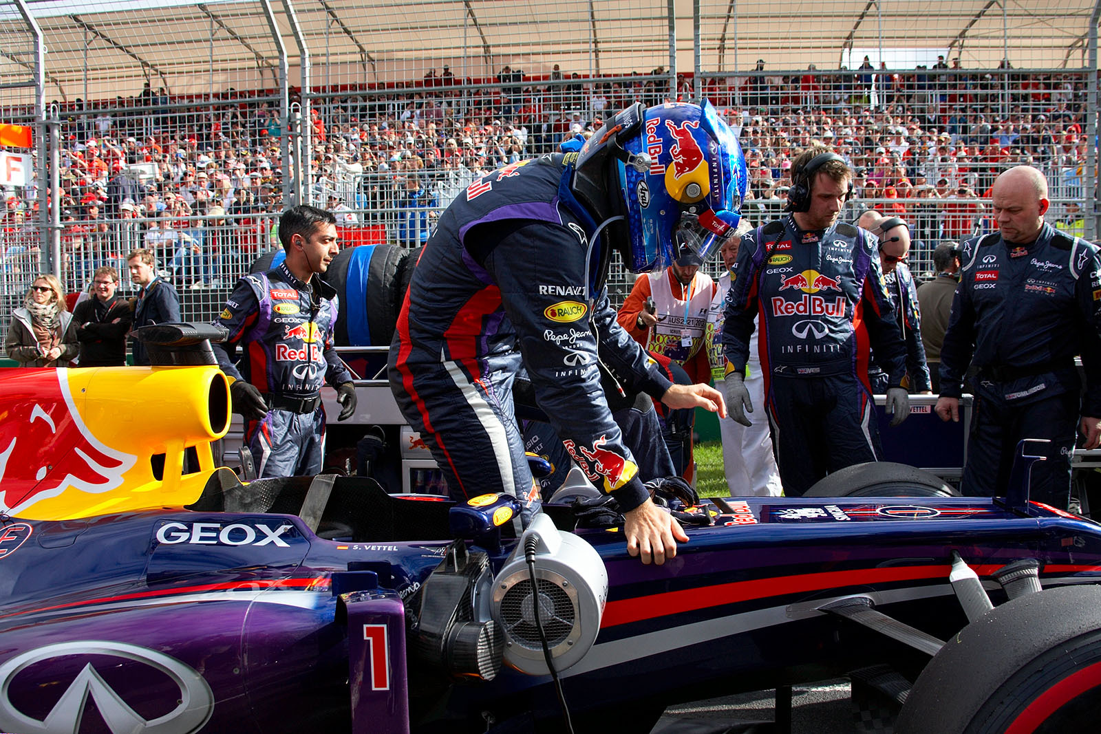 Sebastian Vettel, Red Bull Racing, gets out of his race car at the front row of the grid