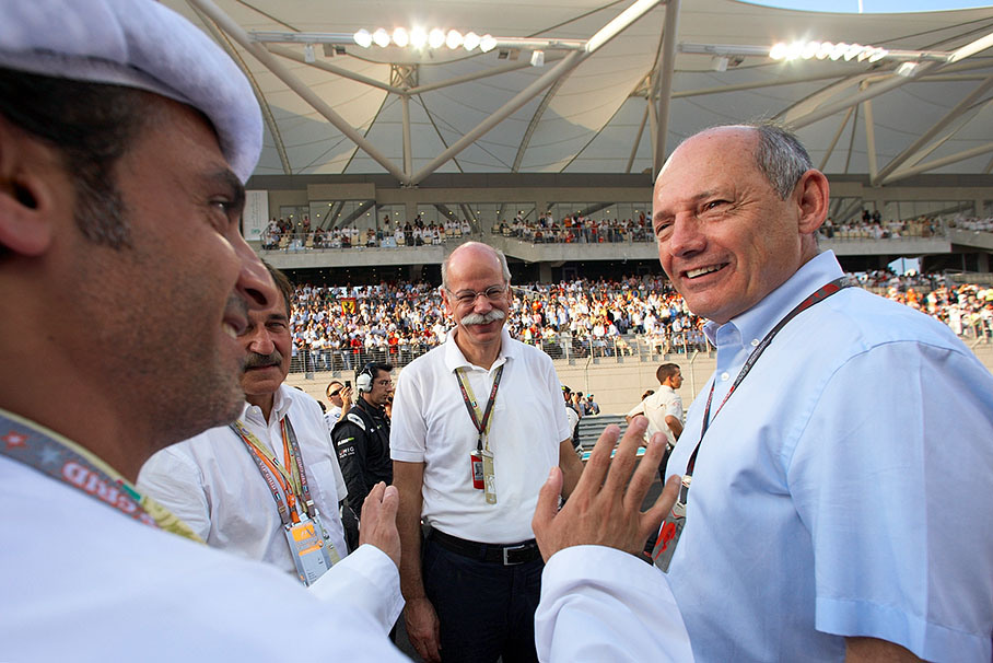 Dr. Dieter Zetsche, Chairman of the Board of Management of Daimler AG, and Ron Dennis of McLaren welcome VIP hosts on the grid (hints on identity appreciated)