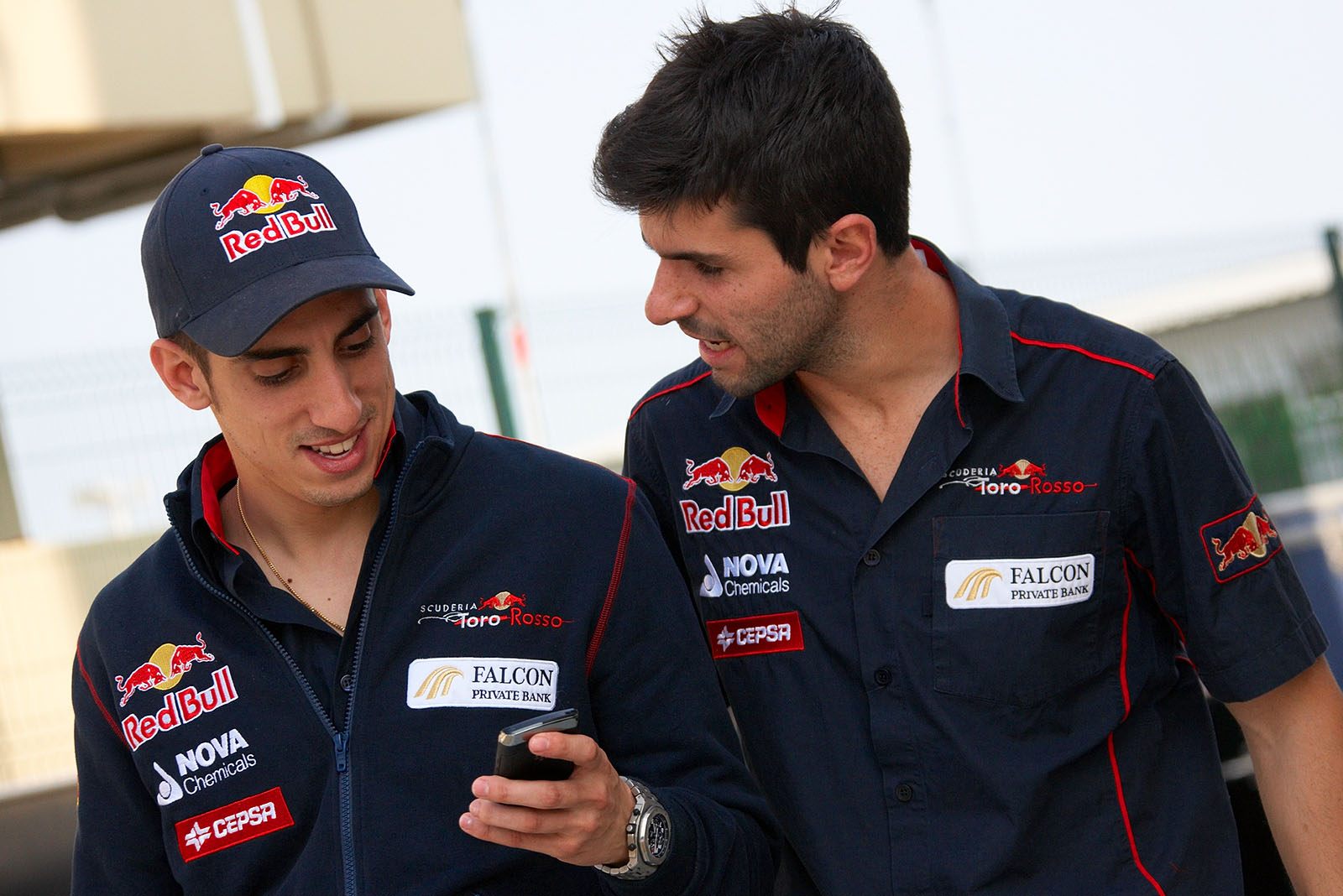 The two Toro Rosso drivers Sebastian Buemi and Jaime Alguersuari stroll together