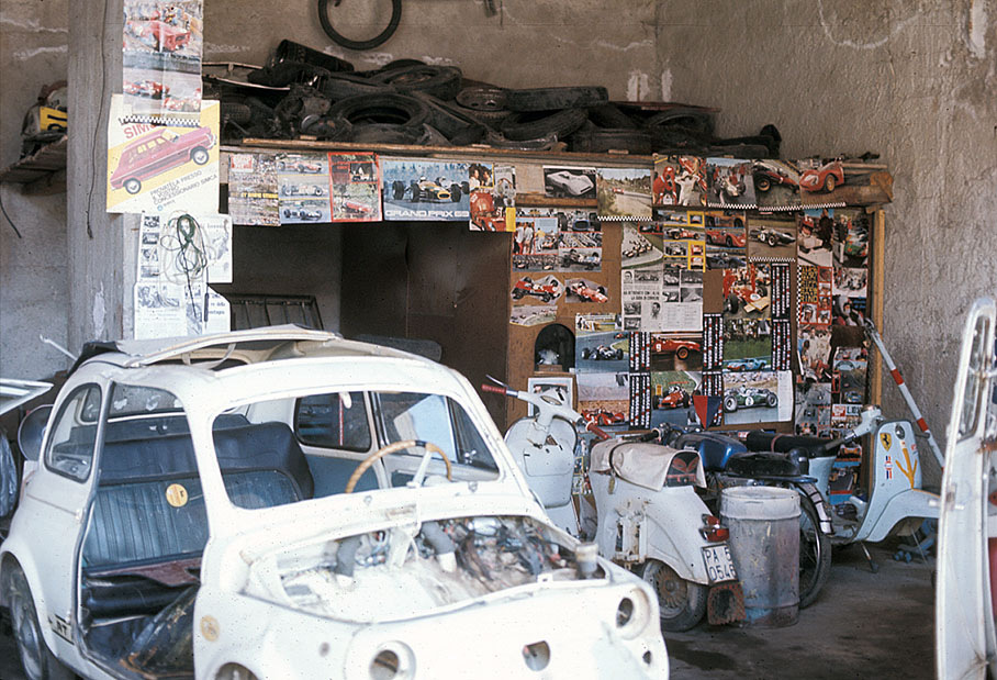 A typical Italian auto repair shop. When Rainer arrived to have his car repaired, the guys knew him already by the racing calendar photos they hung up their wall.