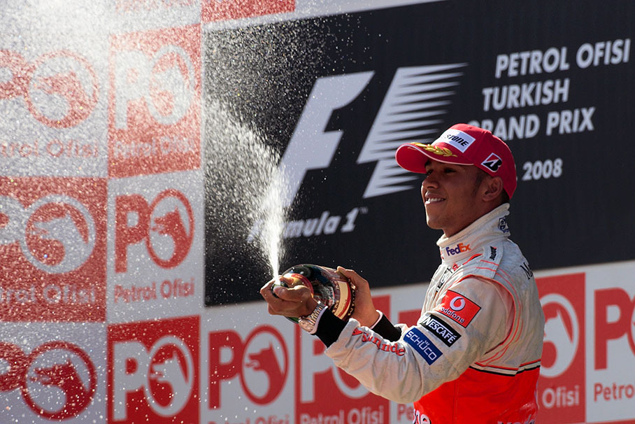 Hamilton sprays a fountain of champagne
