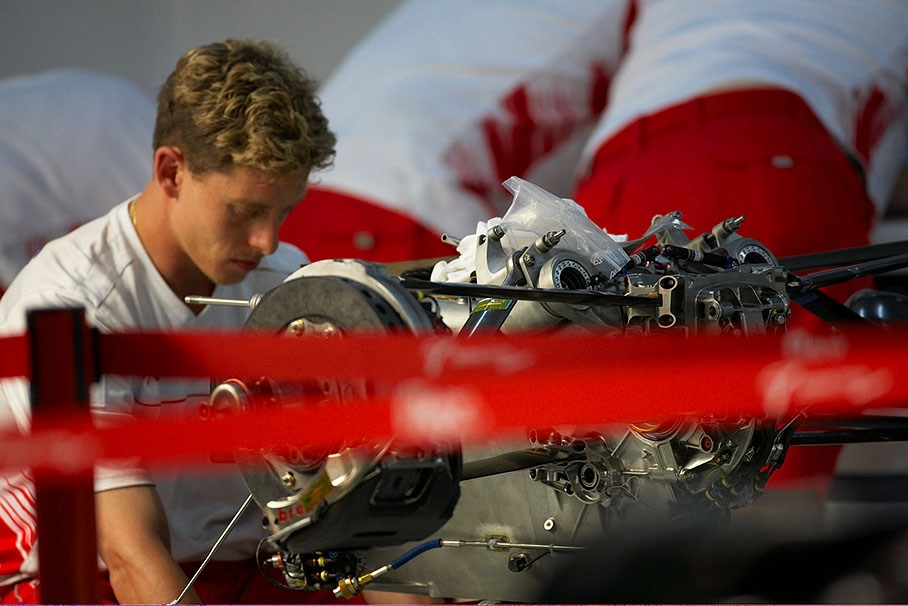 Ferrari mechanics work at a gearbox