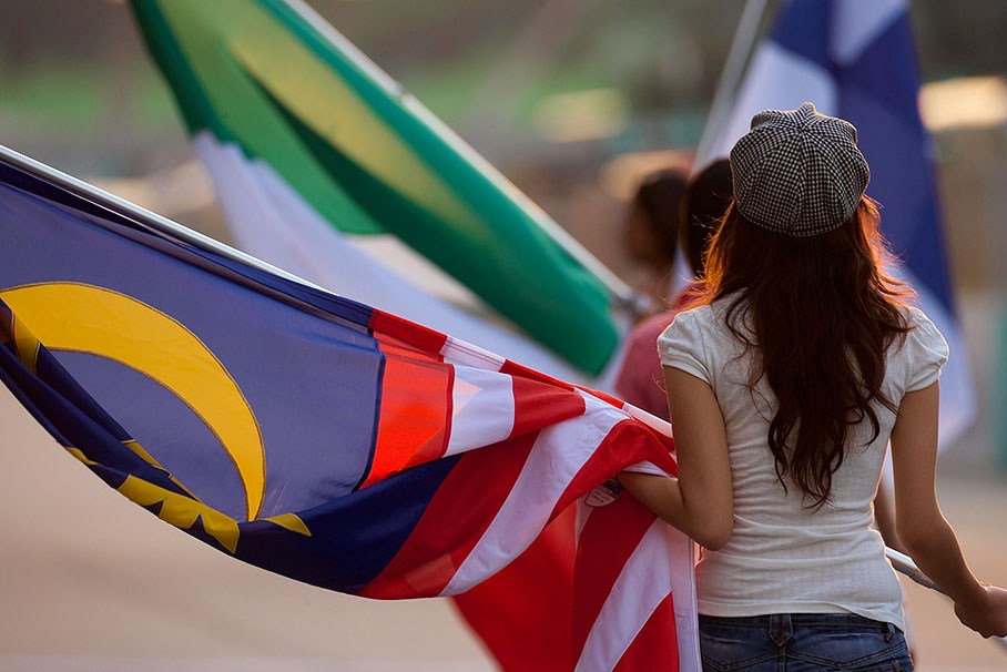 Grid girl with Malaysian national flag